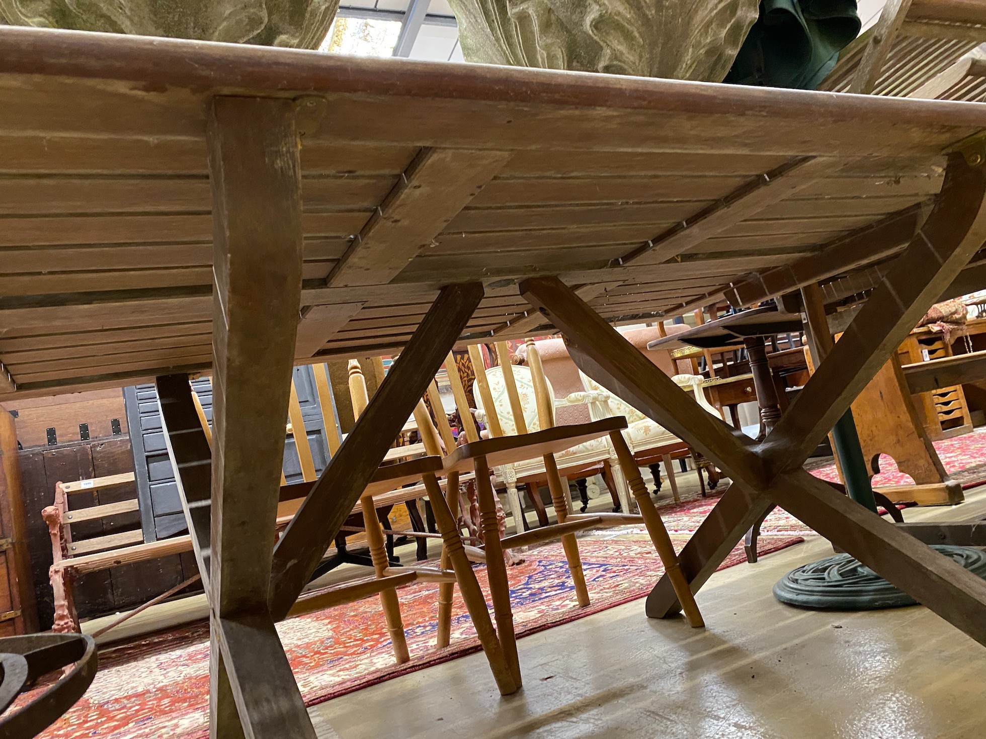 A weathered teak rectangular topped garden table, length 162cm, height 111cm